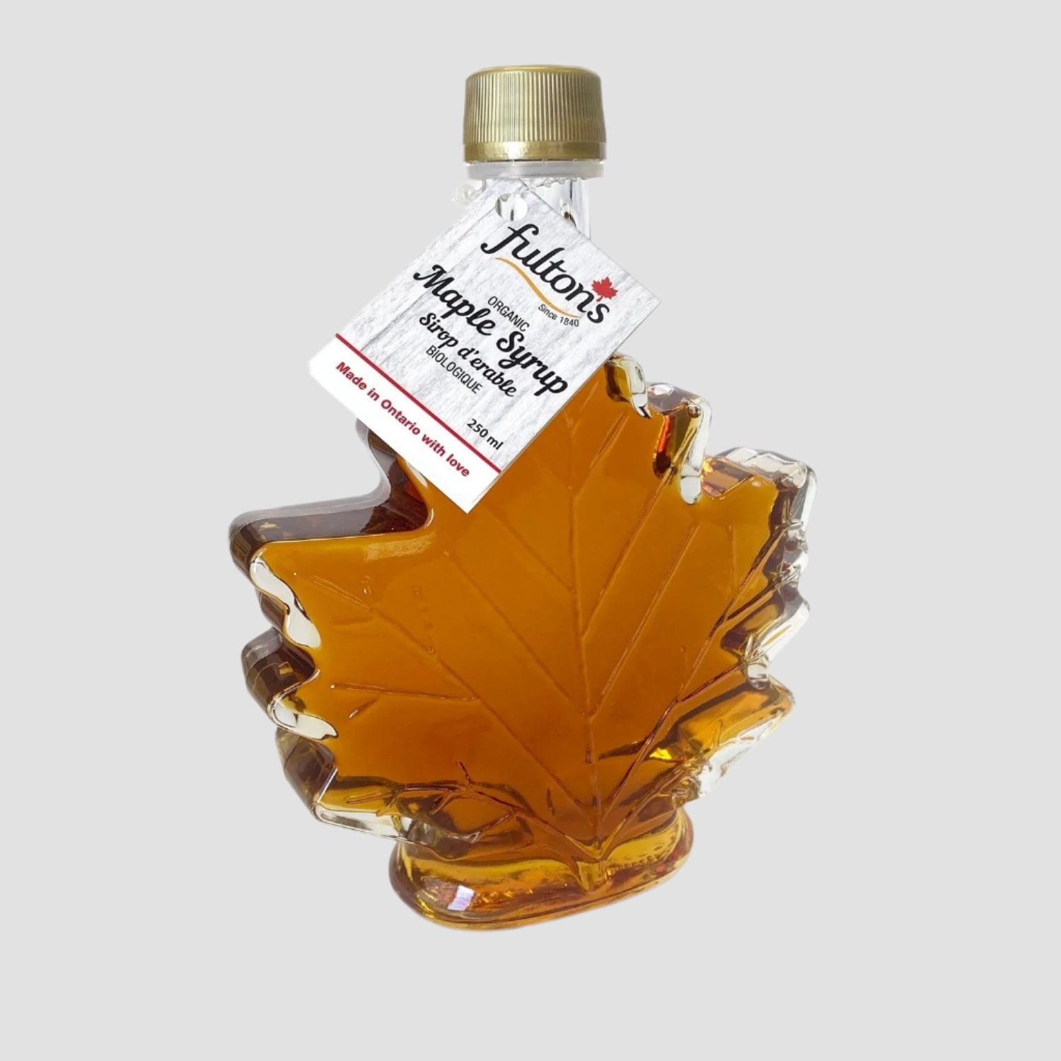 Bottle of Fulton's maple syrup shaped like a maple leaf.