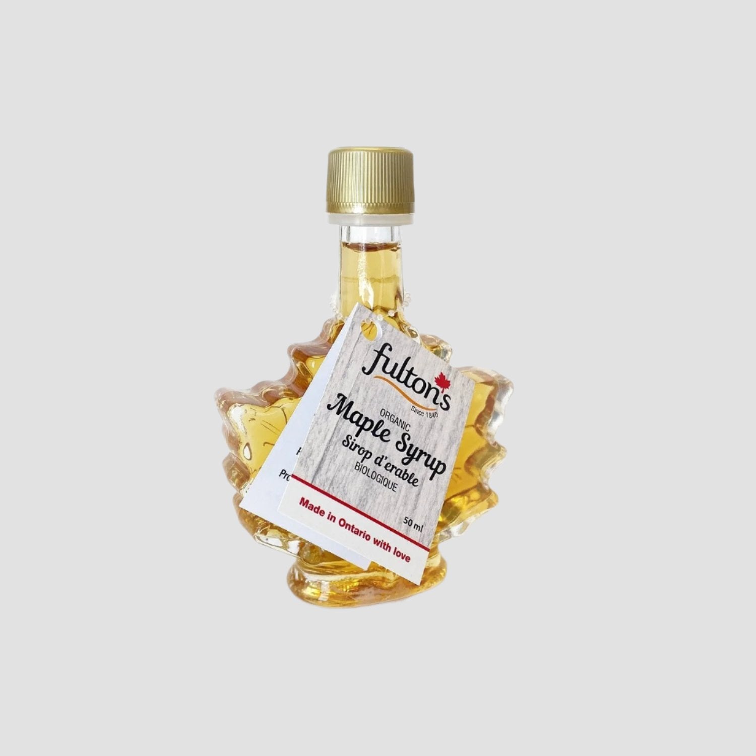 Bottle of Fulton's maple syrup shaped like a maple leaf.