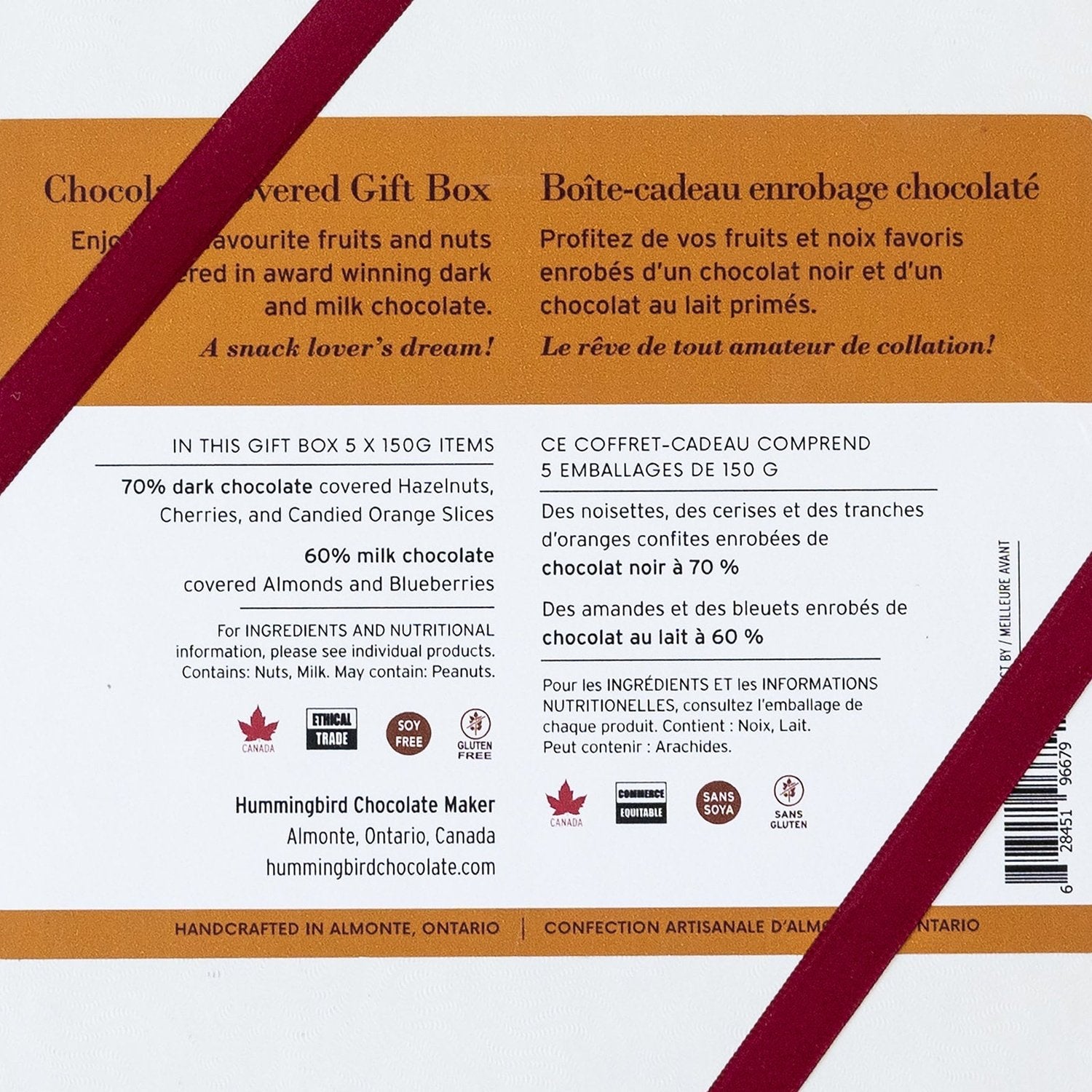 Close up of back gift box label, featuring box contents: Dark chocolate hazelnuts, cherries and orange slices, and milk chocolate almonds and blueberries