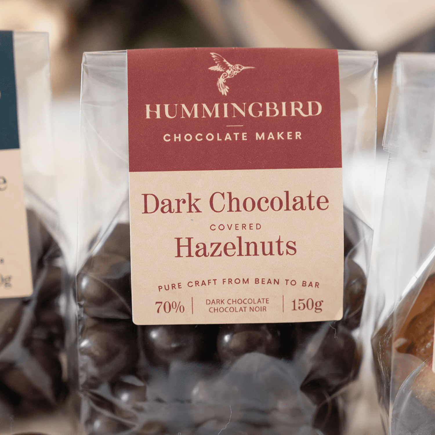 Close up of Dark Chocolate Covered Hazelnuts made with single origin dark bean to bar chocolate