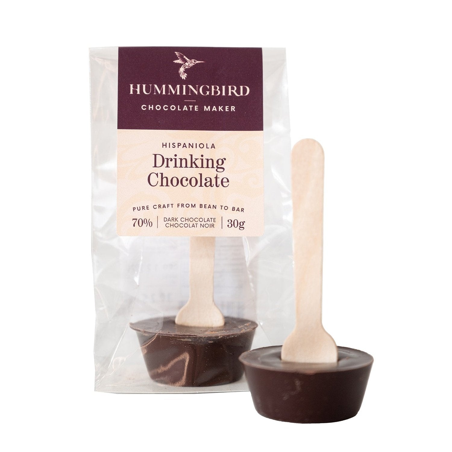 Two drinking chocolate spoons, in and out of packaging, made with bean to bar single origin dark chocolate