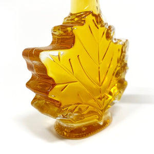 Angle view of maple syrup bottle.