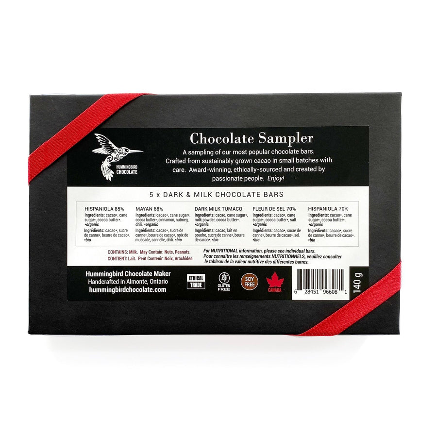 Hummingbird Chocolate Maker, Chocolate Sampler Gift box,  5 x 28g bars, Hispaniola 70%, Fleur de sel, Tumaco Milk, Mayan, Hispaniola 85%. All packaged up in a black box, with a red bow.