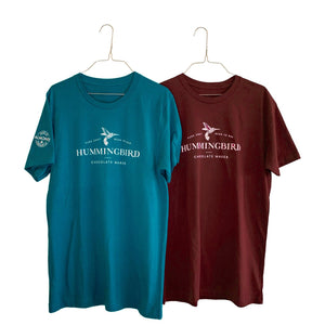 Two Hummingbird Chocolate unisex t-shirts displaying logo branding in Deep Teal and Maroon colours
