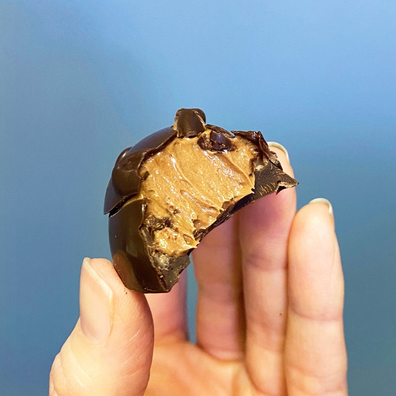 Hummingbird Chocolate Maker - Honey Bunny Bonbons - Bite of bonbon showing the inside filling.